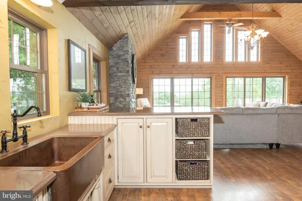 a view of a patio with table and chairs with wooden floor and fence