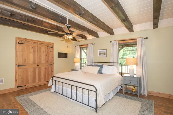 a view of a hallway with a wooden door