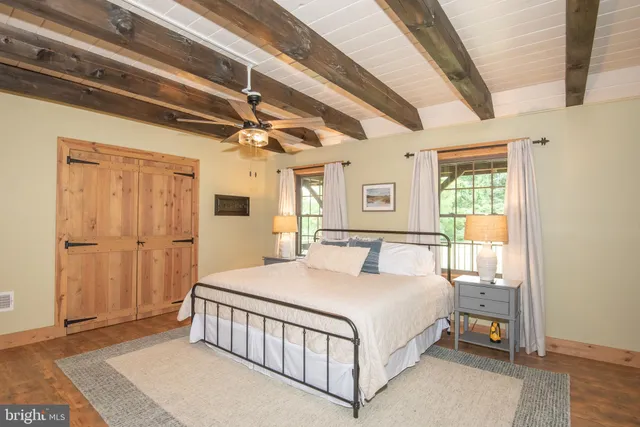 a view of a hallway with a wooden door