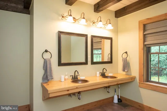 a view of a house with pool and a yard