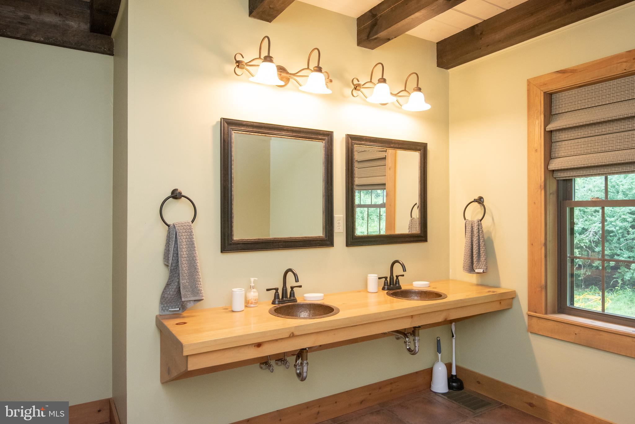 300 Beegle Road Everett, PA 15537 - Photo 23 of 114 a bathroom with a sink and a mirror