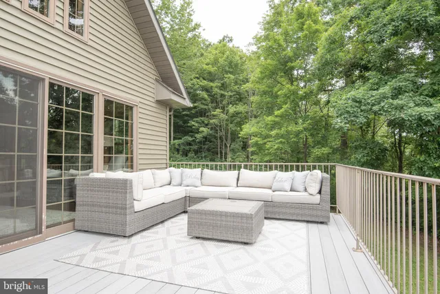 a view of a green field with trees in the background