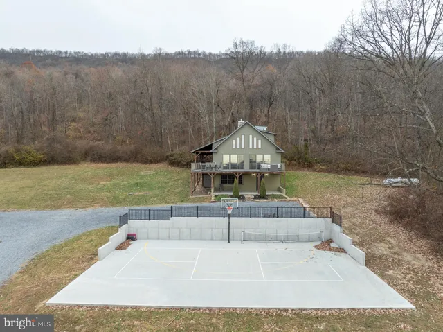 a living room with furniture and large windows