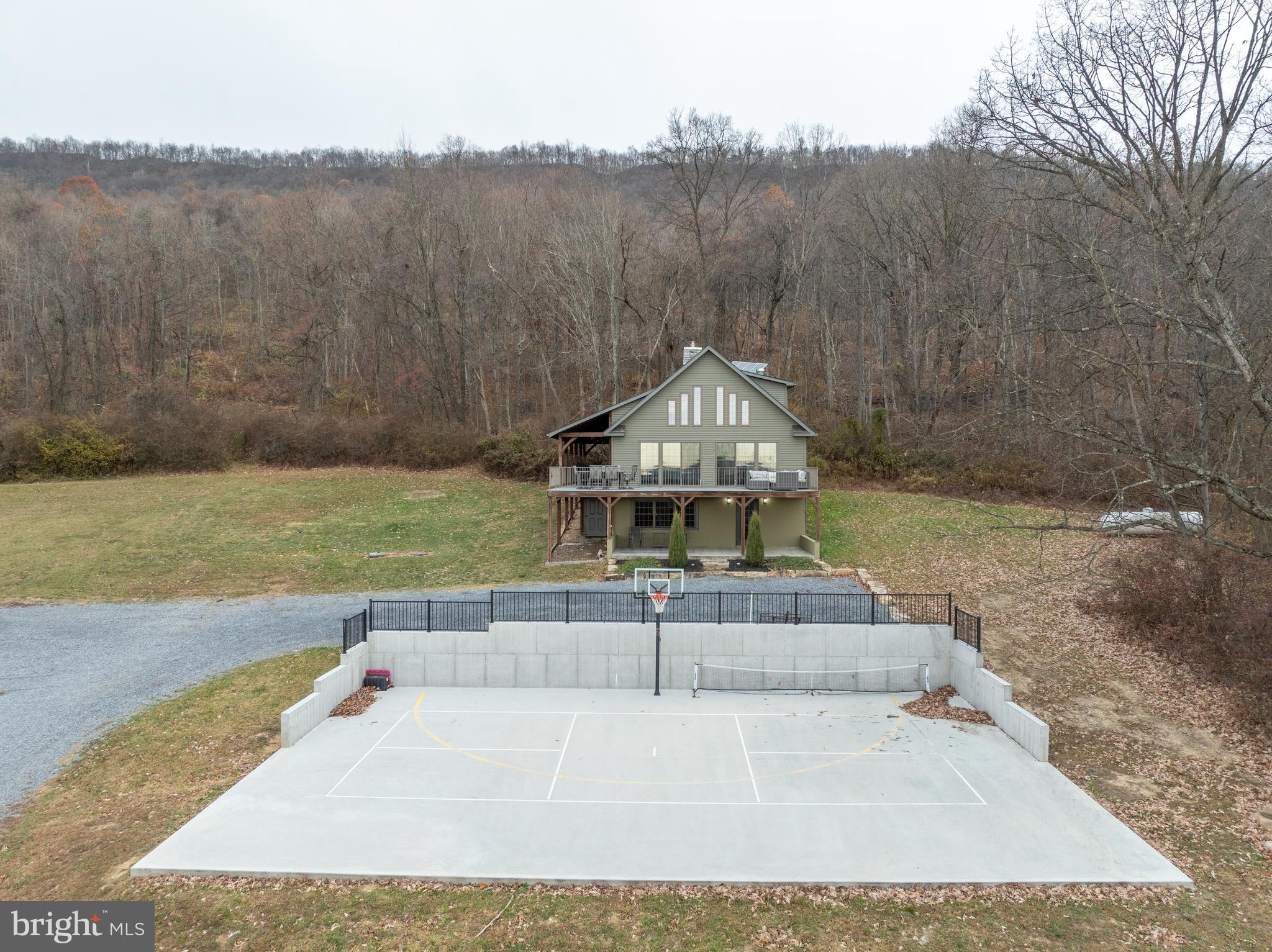 300 Beegle Road Everett, PA 15537 - Photo 3 of 114 a view of a swimming pool with a yard and large tree