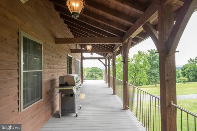 a view of a house with a yard and balcony