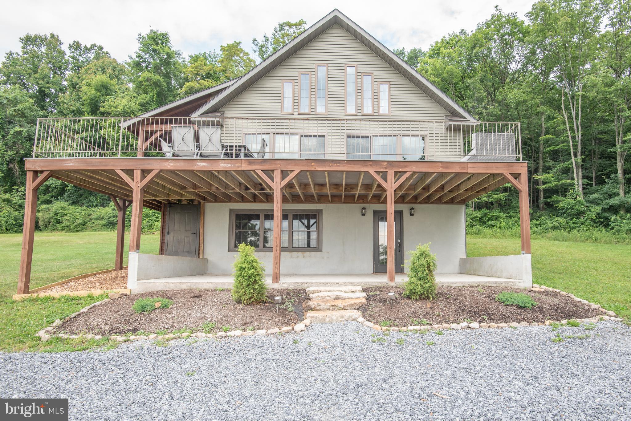 300 Beegle Road Everett, PA 15537 - Photo 4 of 114 a front view of a house with garden