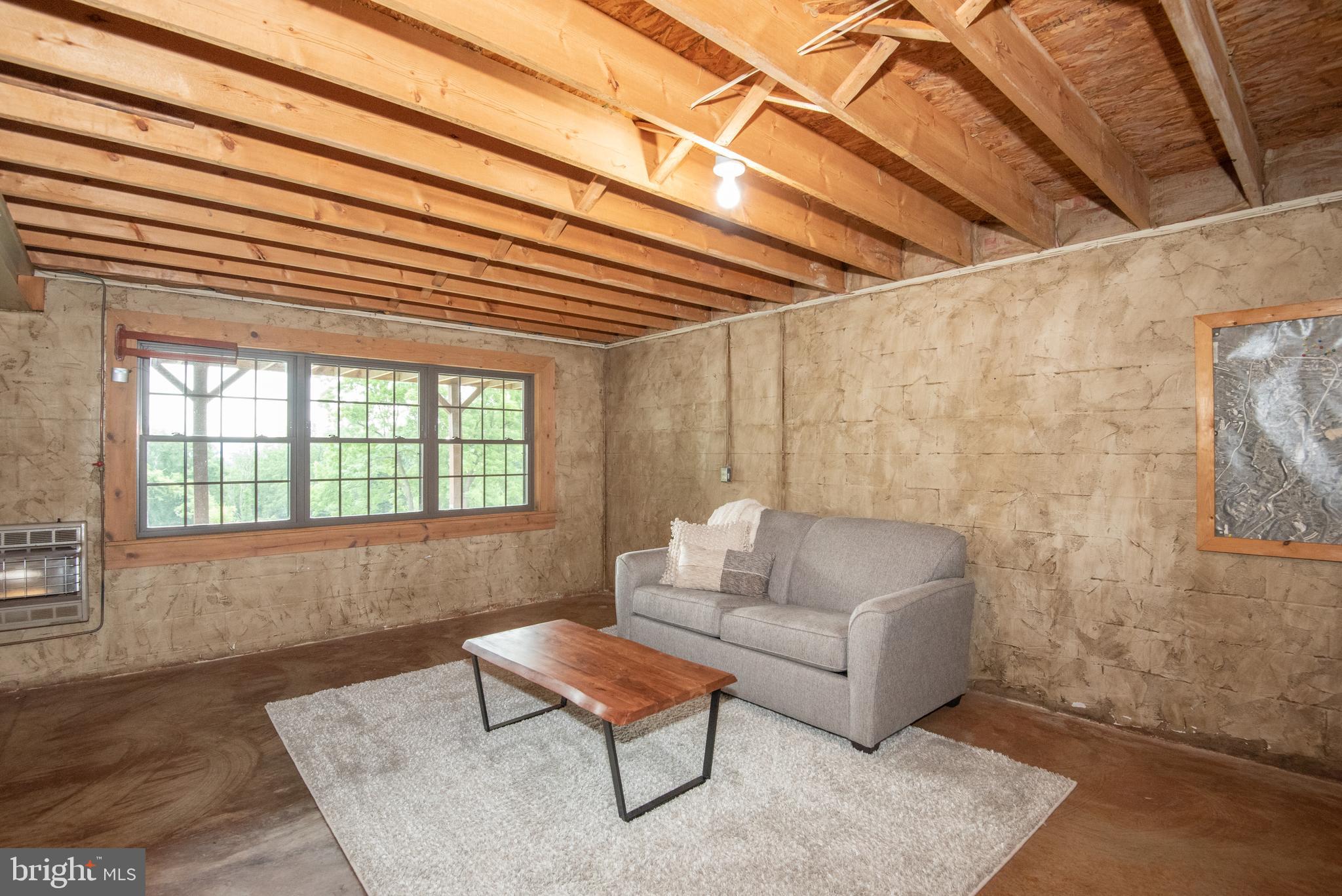 300 Beegle Road Everett, PA 15537 - Photo 47 of 114 a living room with furniture and a rug