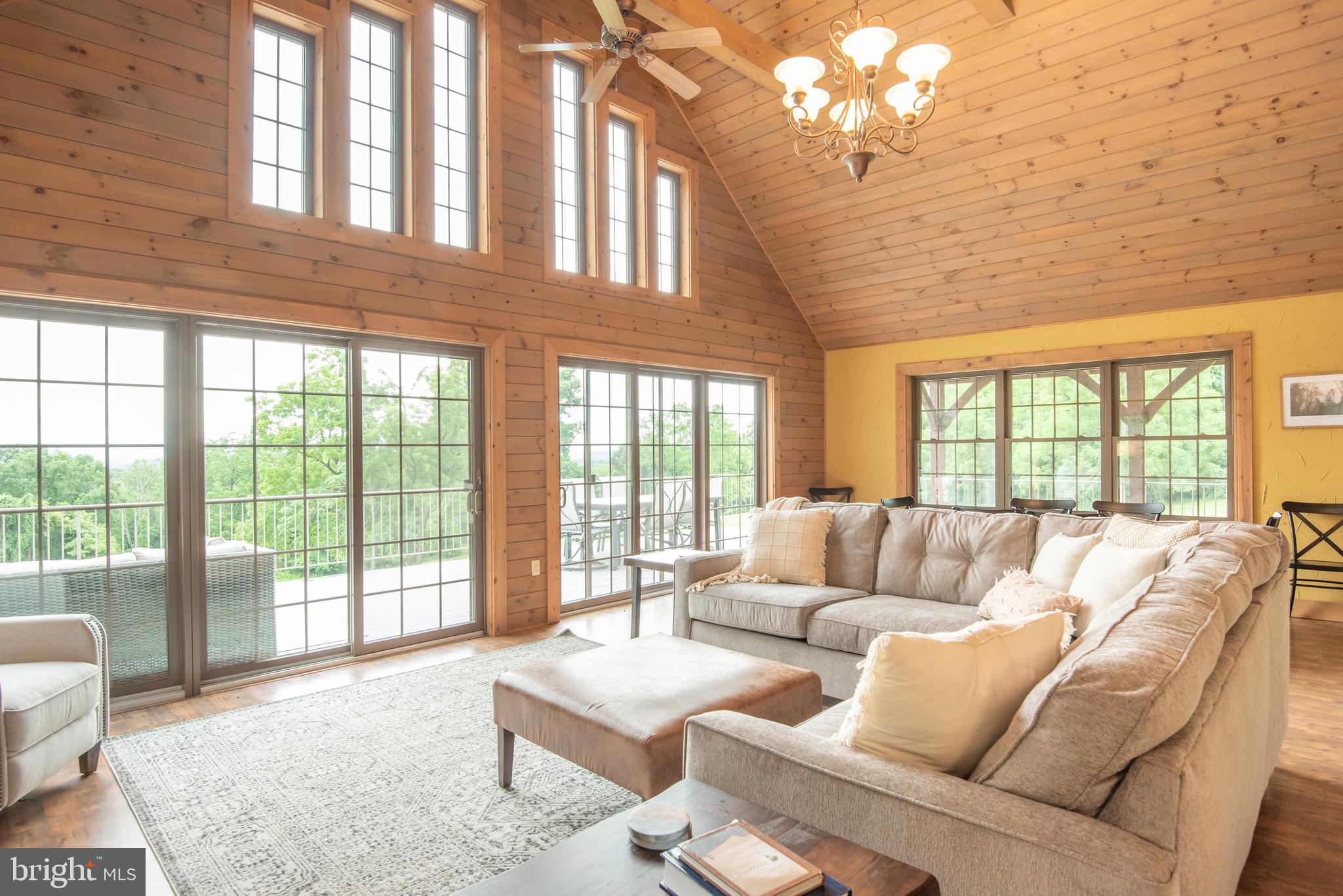 300 Beegle Road Everett, PA 15537 - Photo 5 of 114 a living room with furniture and large windows