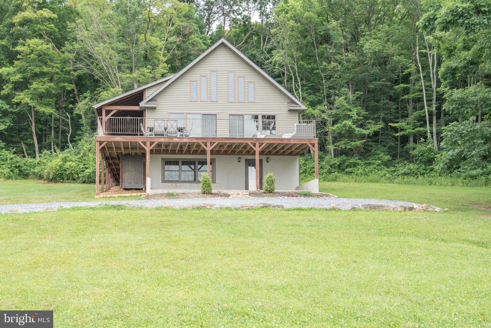 300 Beegle Road Everett, PA 15537 - Photo 52 of 114 a view of a house with pool and a yard