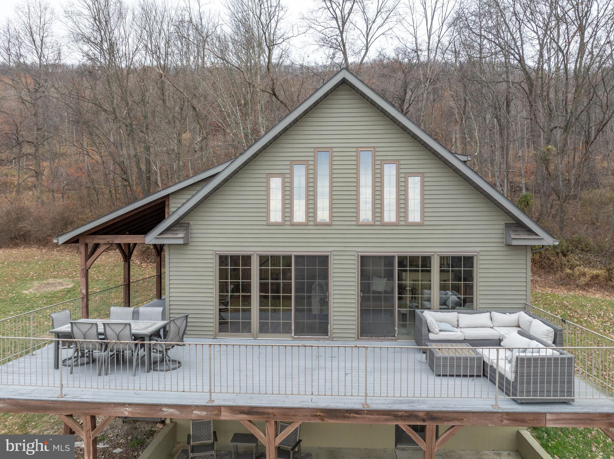 300 Beegle Road Everett, PA 15537 - Photo 71 of 114 a backyard of a house with table and chairs