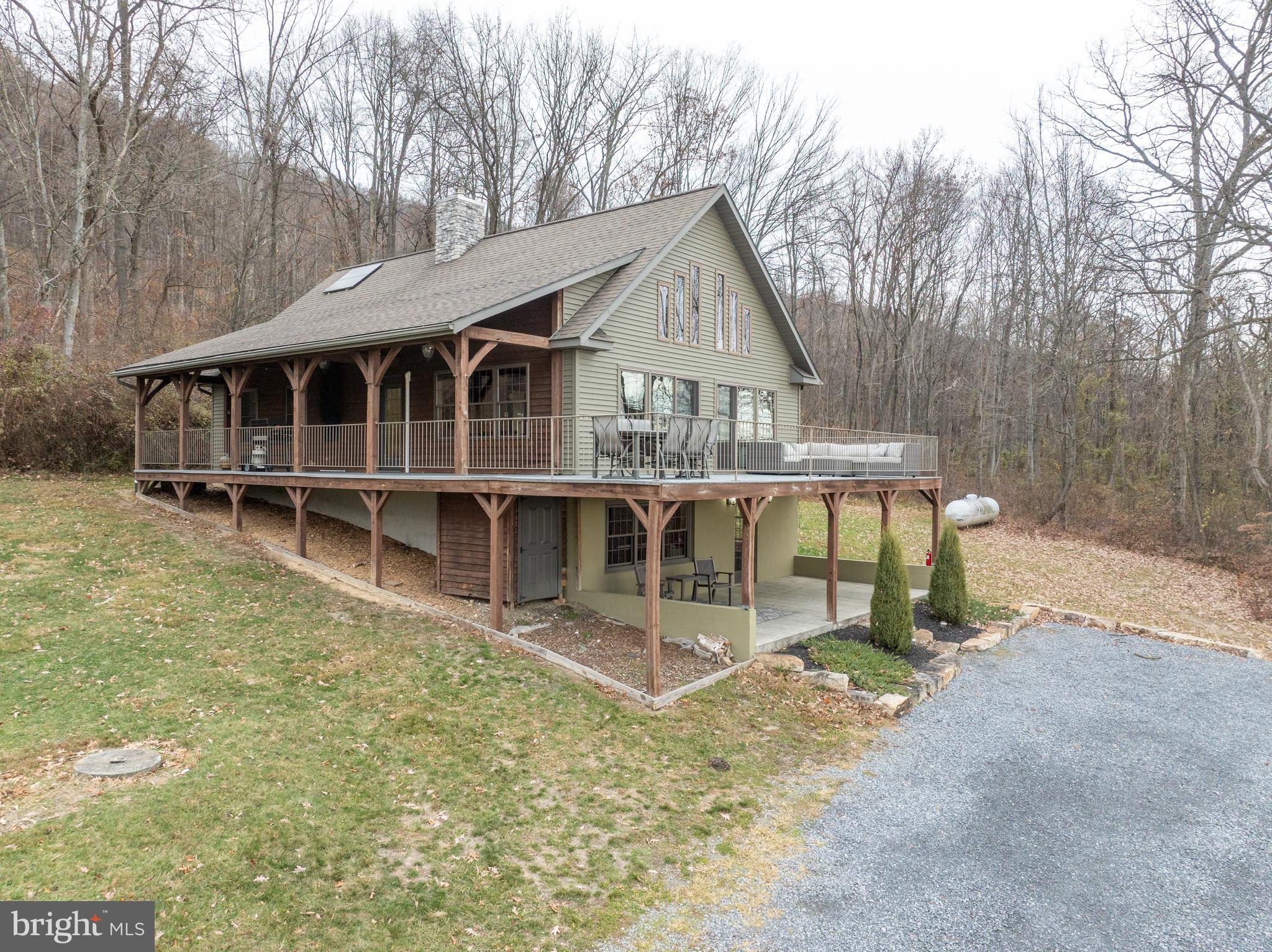 300 Beegle Road Everett, PA 15537 - Photo 73 of 114 a view of a house with a yard and balcony