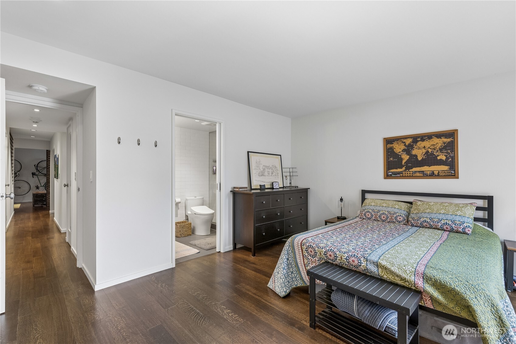 88 Virginia Street, Unit 2 Seattle, WA 98121 - Photo 13 of 20 a bedroom with a bed and wooden floor