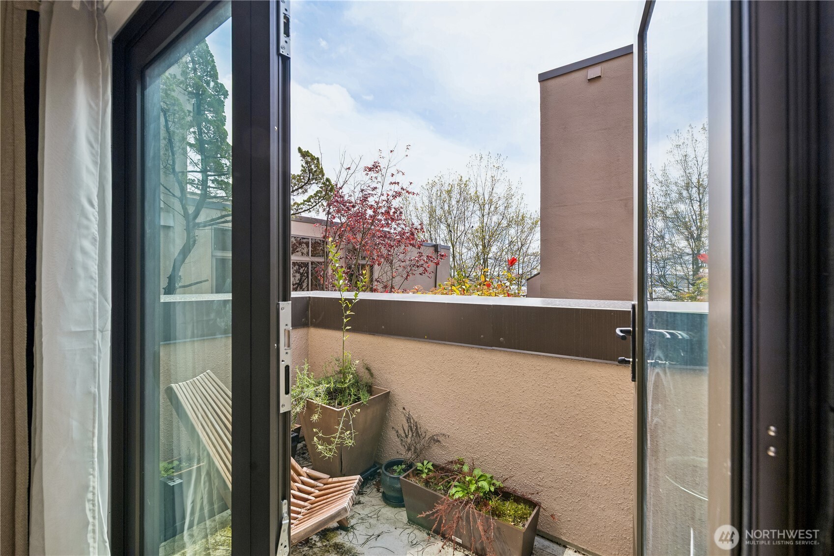 88 Virginia Street, Unit 2 Seattle, WA 98121 - Photo 15 of 20 a view of a glass door and the balcony