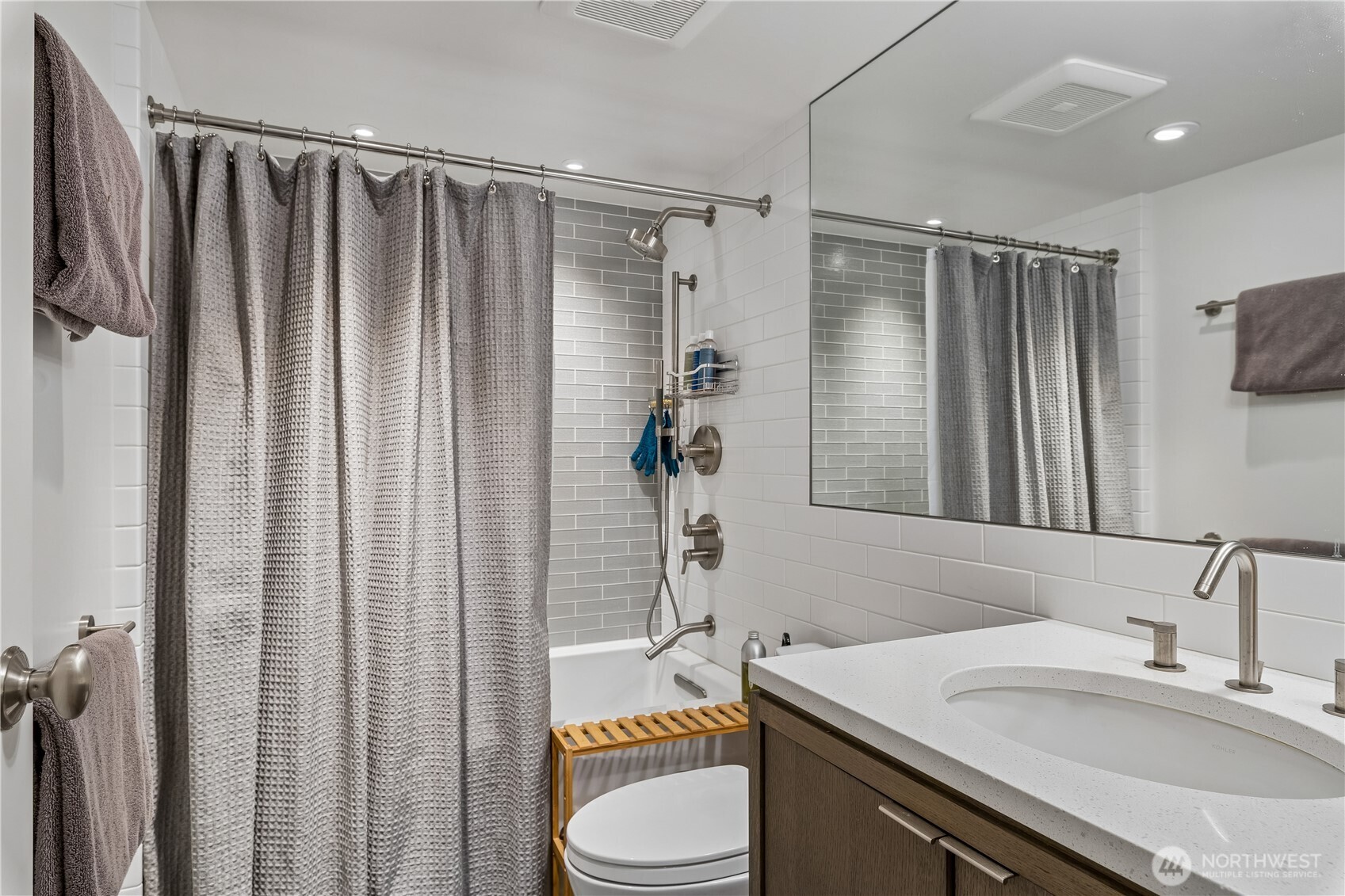 88 Virginia Street, Unit 2 Seattle, WA 98121 - Photo 19 of 20 a bathroom with a sink a toilet and shower