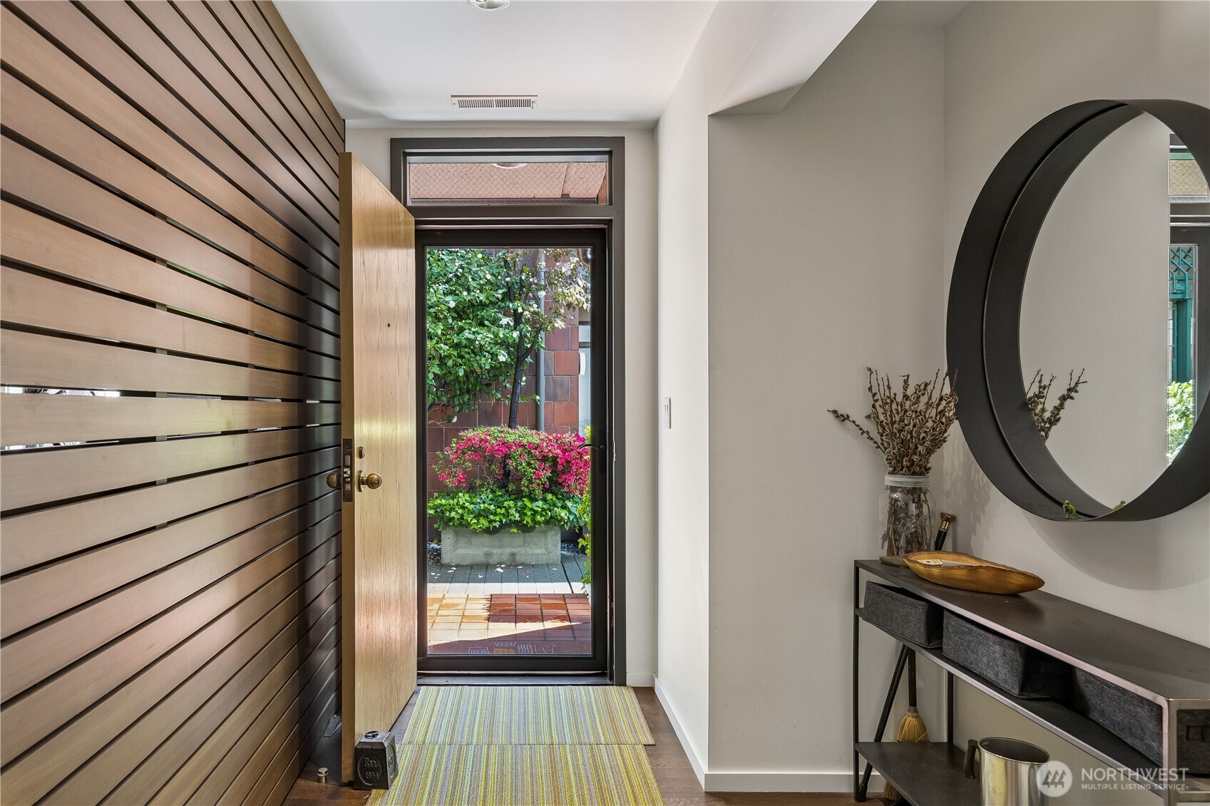 88 Virginia Street, Unit 2 Seattle, WA 98121 - Photo 2 of 20 a view of a entryway with wooden floor