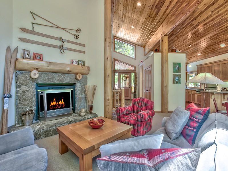 1018 Snow Crest Road Alpine Meadows, CA 96146 - Photo 2 of 14 a living room with furniture a table and a fireplace