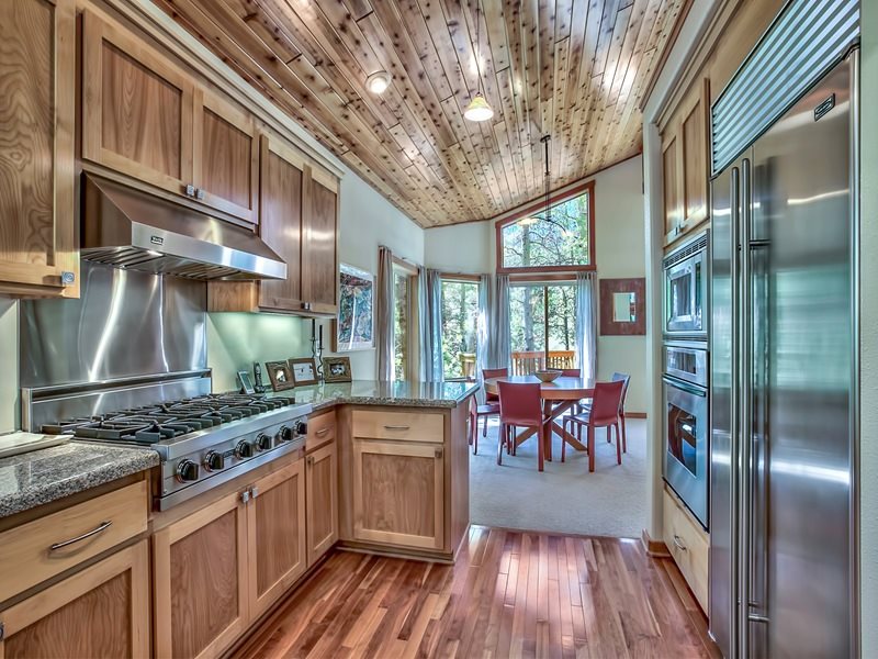 1018 Snow Crest Road Alpine Meadows, CA 96146 - Photo 4 of 14 a kitchen with stainless steel appliances granite countertop a stove and cabinets