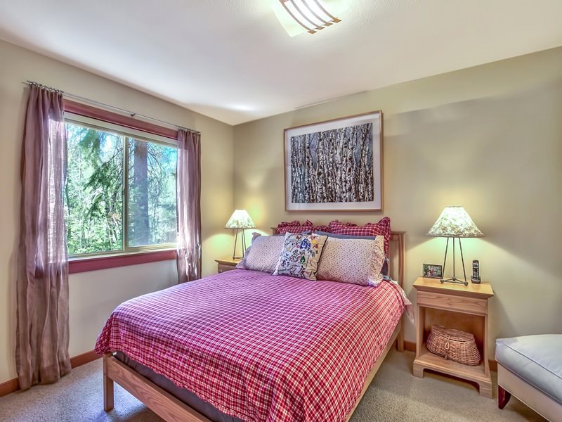 1018 Snow Crest Road Alpine Meadows, CA 96146 - Photo 10 of 14 a bedroom with a bed a lamp and a window