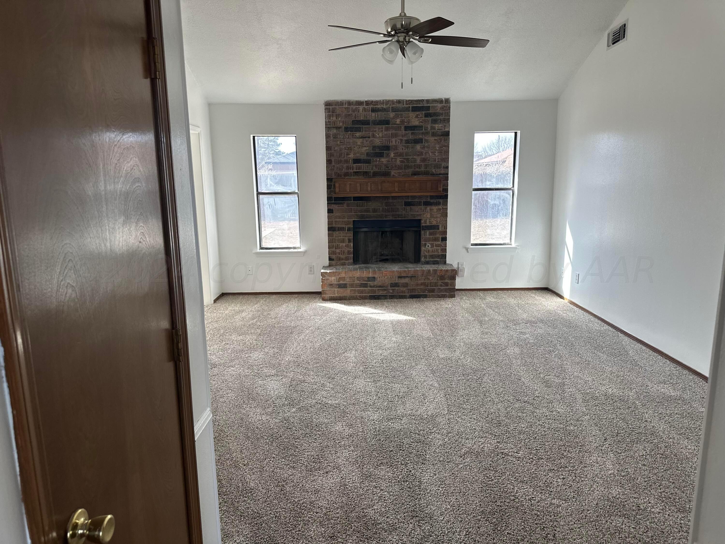 4225 Jamie Trail Amarillo, TX 79110 - Photo 2 of 15 a view of an empty room with a window