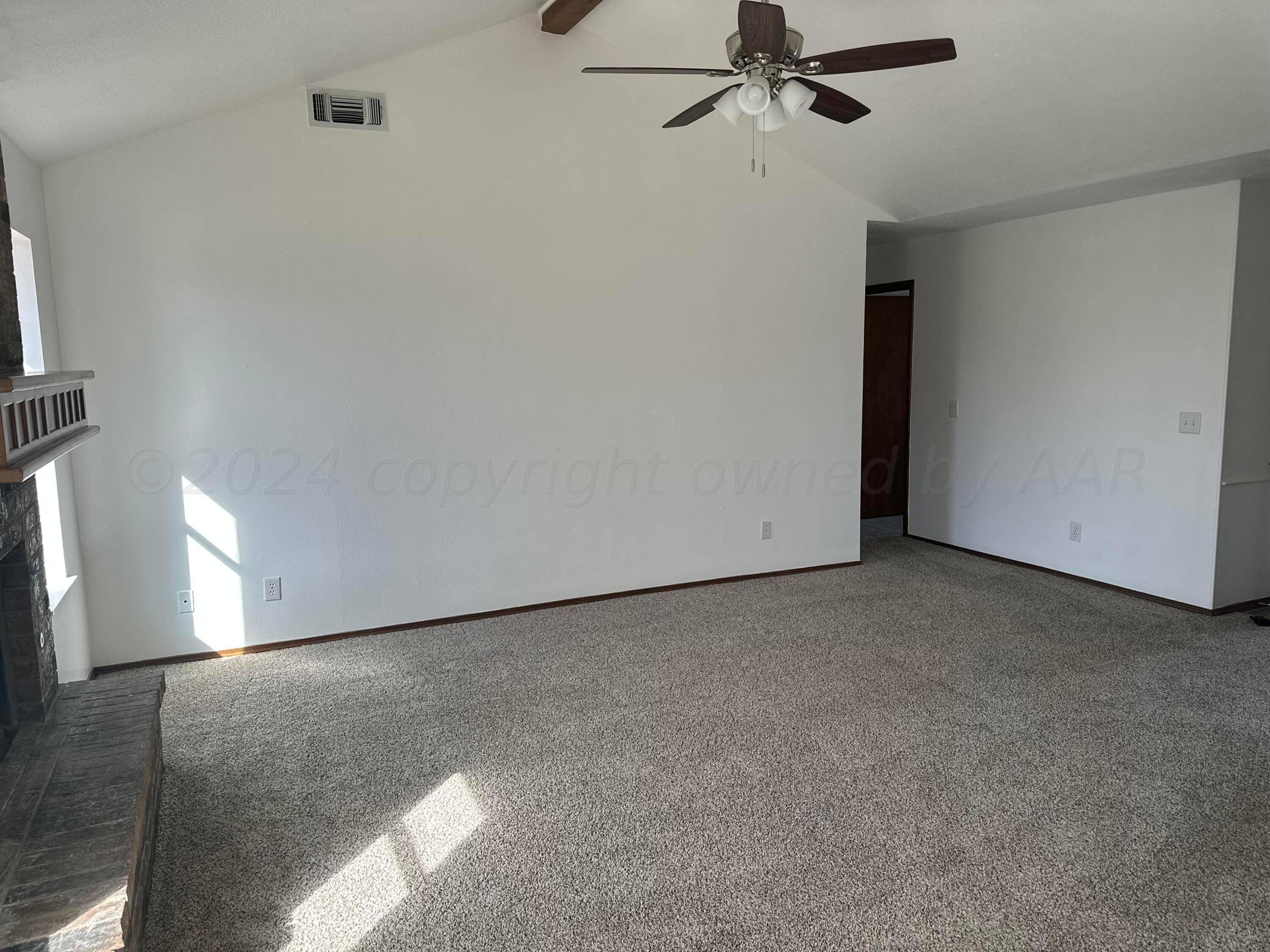 4225 Jamie Trail Amarillo, TX 79110 - Photo 3 of 15 a view of a room with a ceiling fan and window