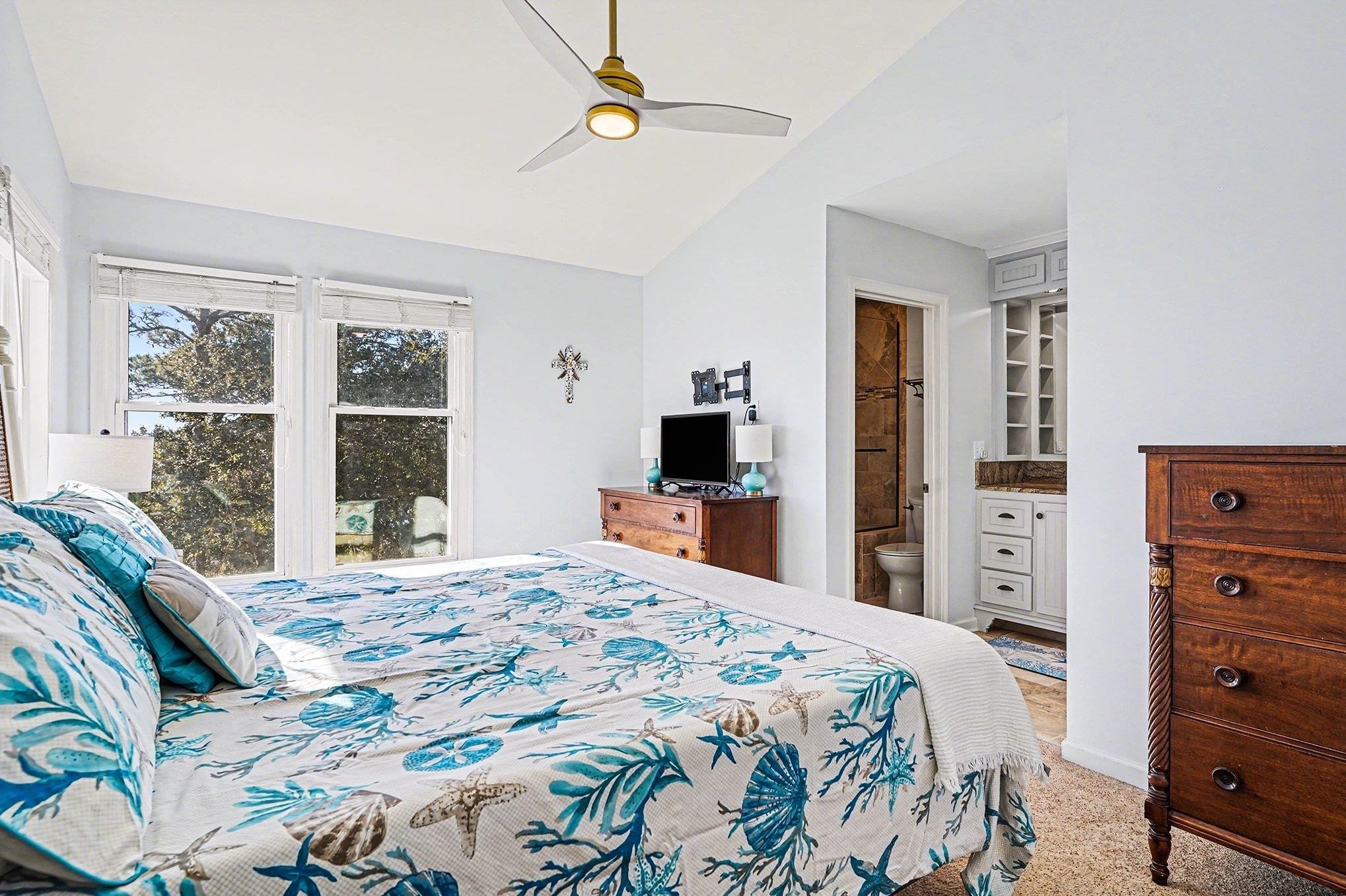 4999 Highway 17 Business, Unit 304D Murrells Inlet, SC 29576 - Photo 15 of 33 Bedroom with light colored carpet, a ceiling fan, vaulted ceiling, and connected bathroom