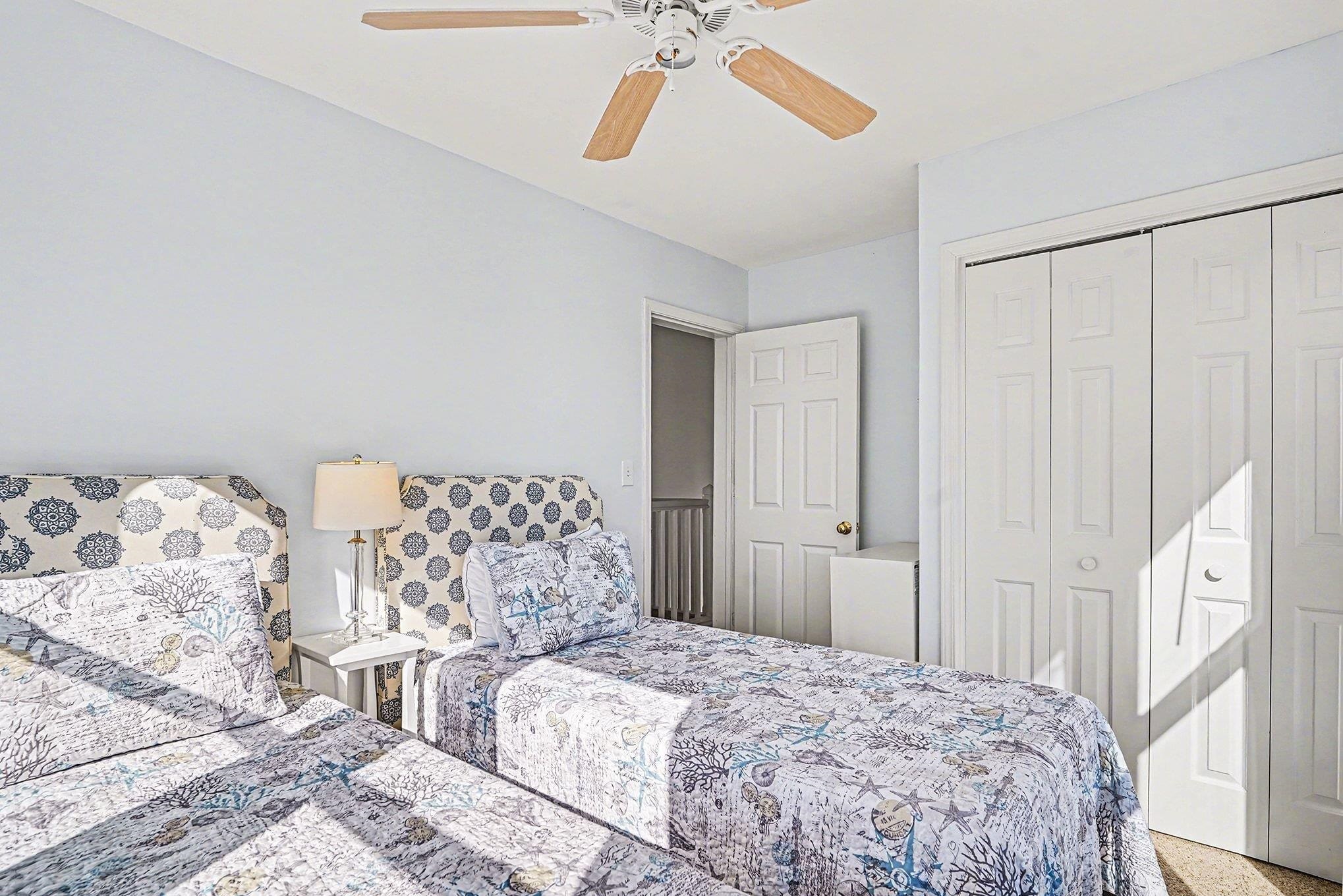 4999 Highway 17 Business, Unit 304D Murrells Inlet, SC 29576 - Photo 20 of 33 Bedroom with ceiling fan, a closet, and carpet flooring