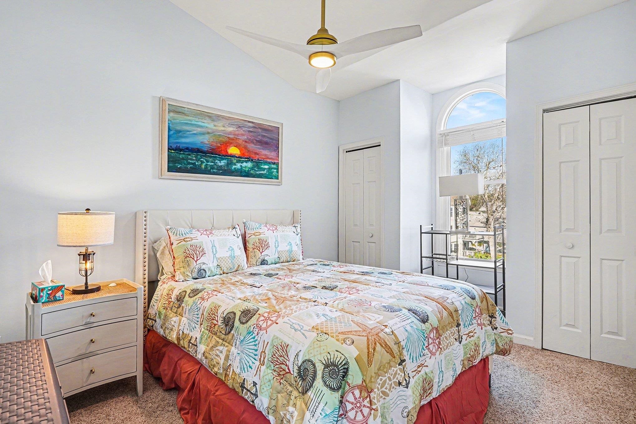 4999 Highway 17 Business, Unit 304D Murrells Inlet, SC 29576 - Photo 23 of 33 Bedroom with multiple closets, carpet floors, a ceiling fan, and vaulted ceiling