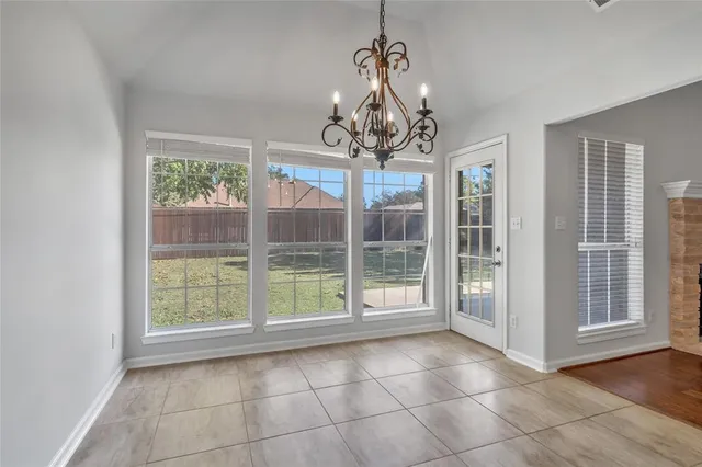 a view of a room with windows and chandelier