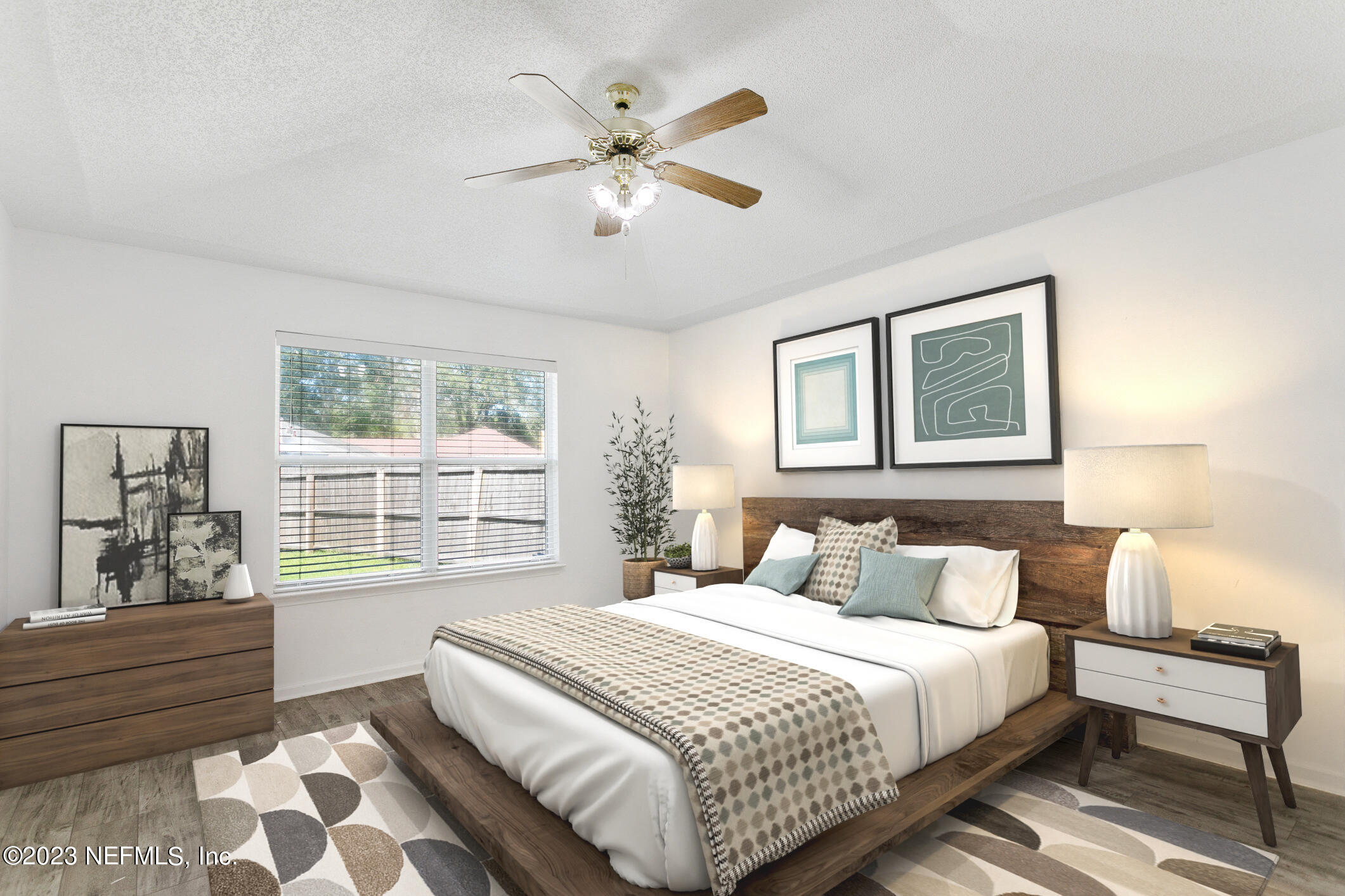 6650 Ricker Road Jacksonville, FL 32244 - Photo 11 of 41 a bedroom with a large bed and a window