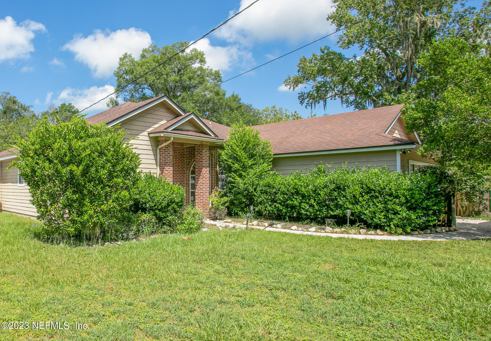 6650 Ricker Road Jacksonville, FL 32244 - Photo 2 of 41 a front view of a house with a yard