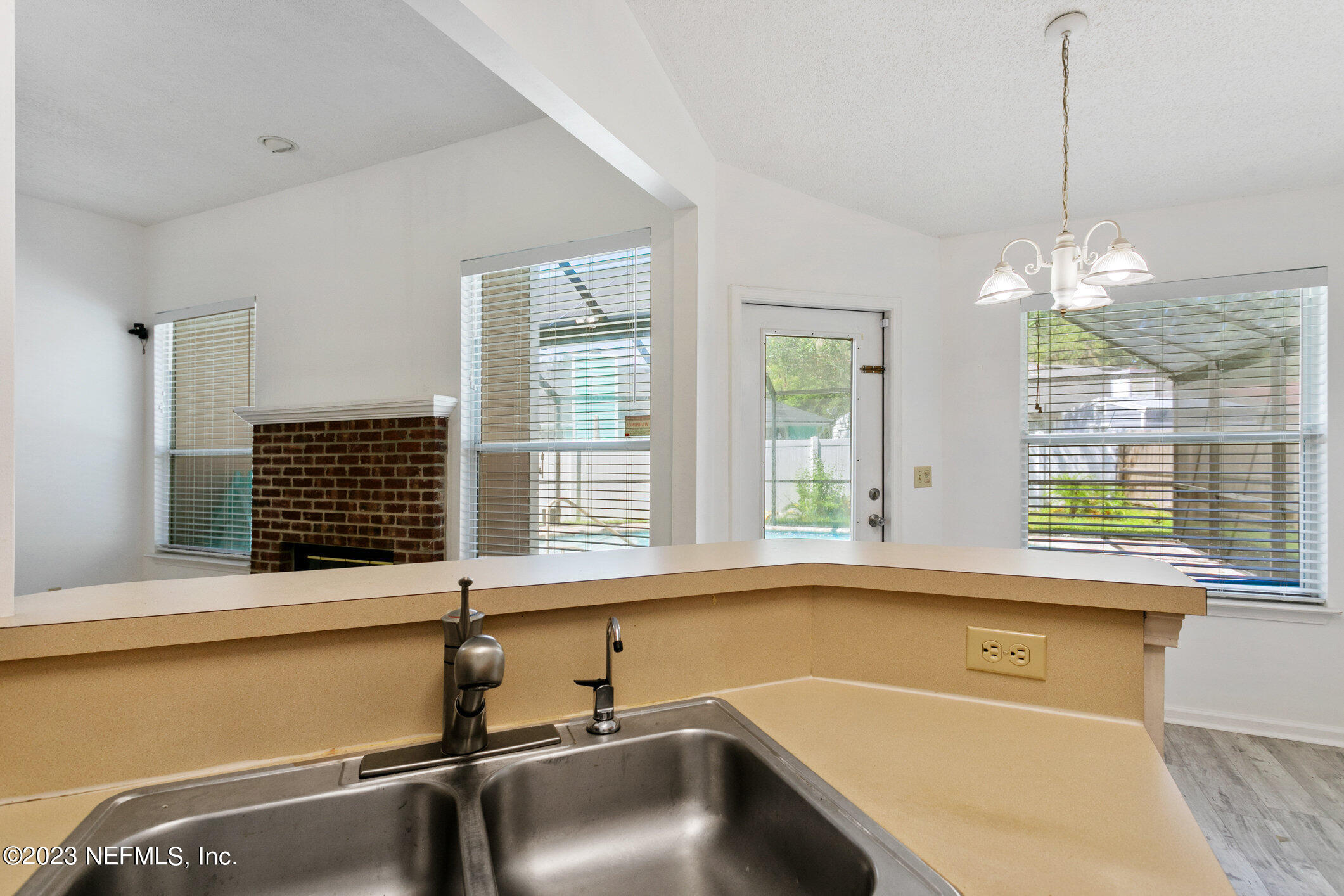 6650 Ricker Road Jacksonville, FL 32244 - Photo 22 of 41 a bathroom with a tub sink and window
