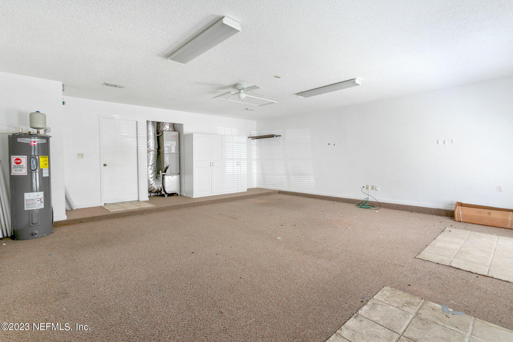 6650 Ricker Road Jacksonville, FL 32244 - Photo 31 of 41 an empty room with closet and windows
