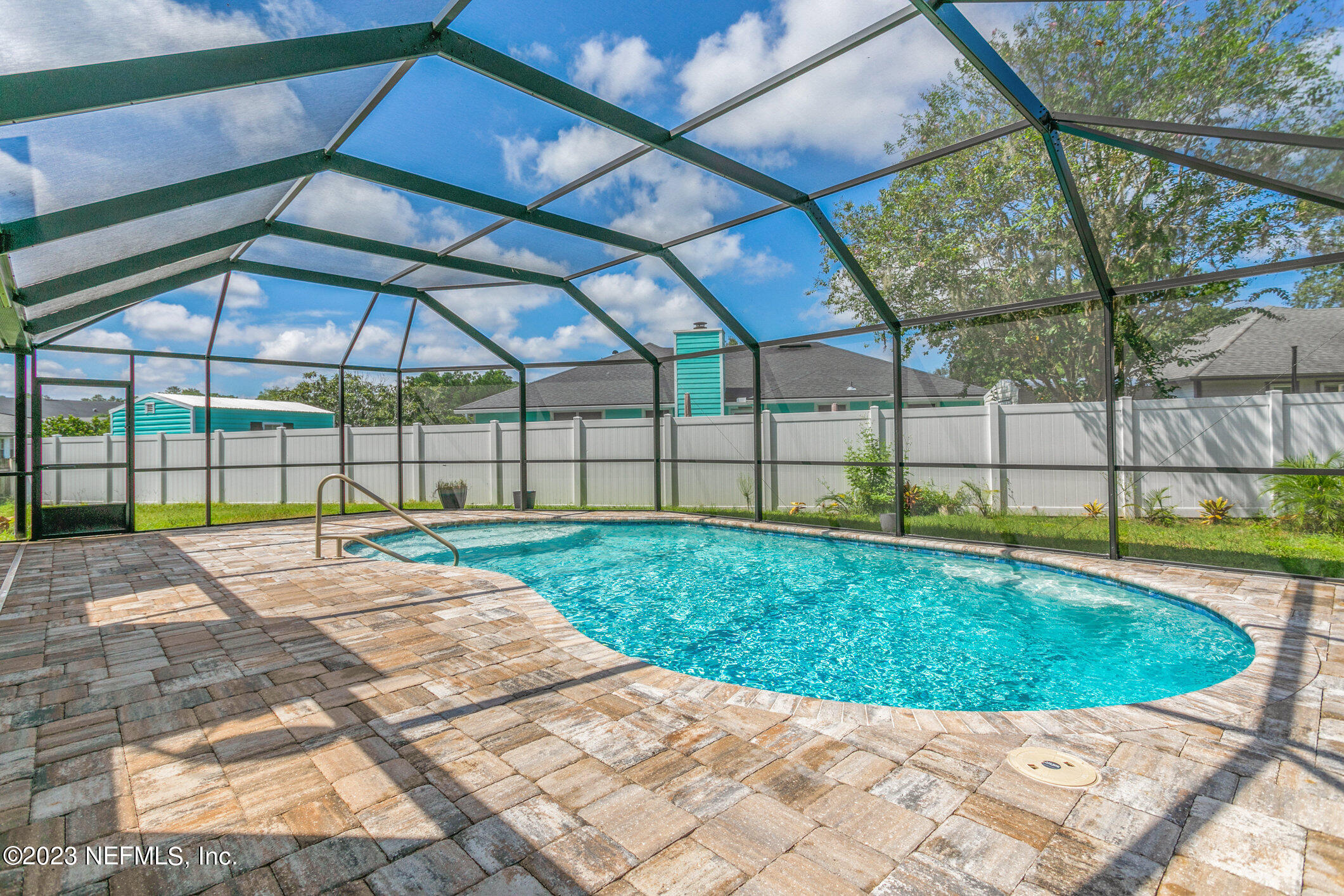 6650 Ricker Road Jacksonville, FL 32244 - Photo 34 of 41 a view of a backyard with a swimming pool