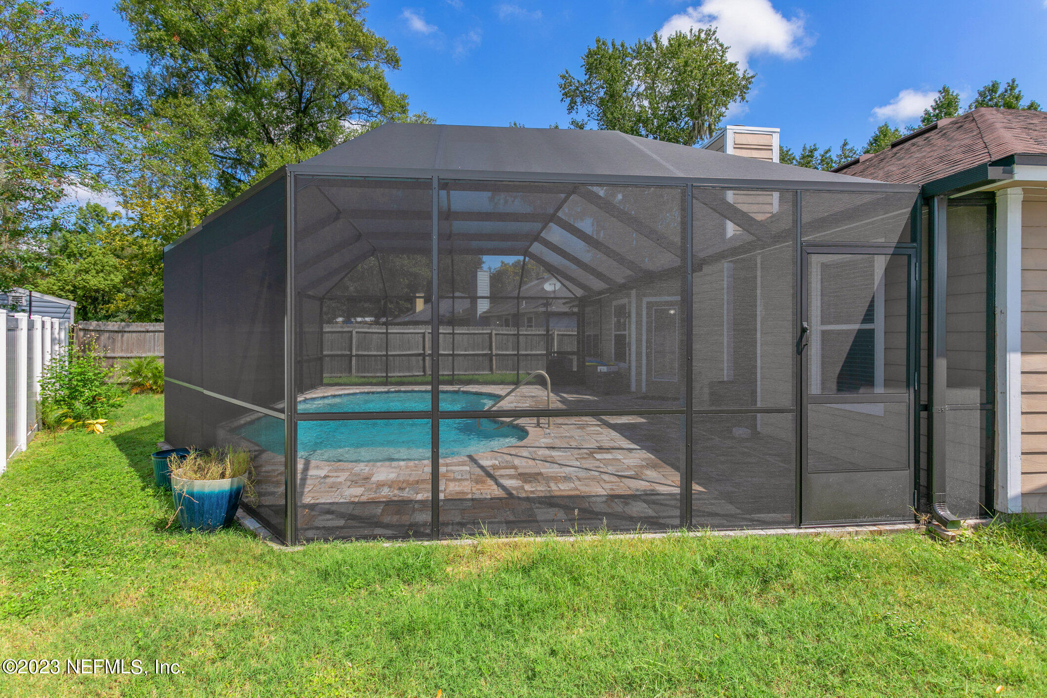 6650 Ricker Road Jacksonville, FL 32244 - Photo 35 of 41 a backyard of a house with table and chairs