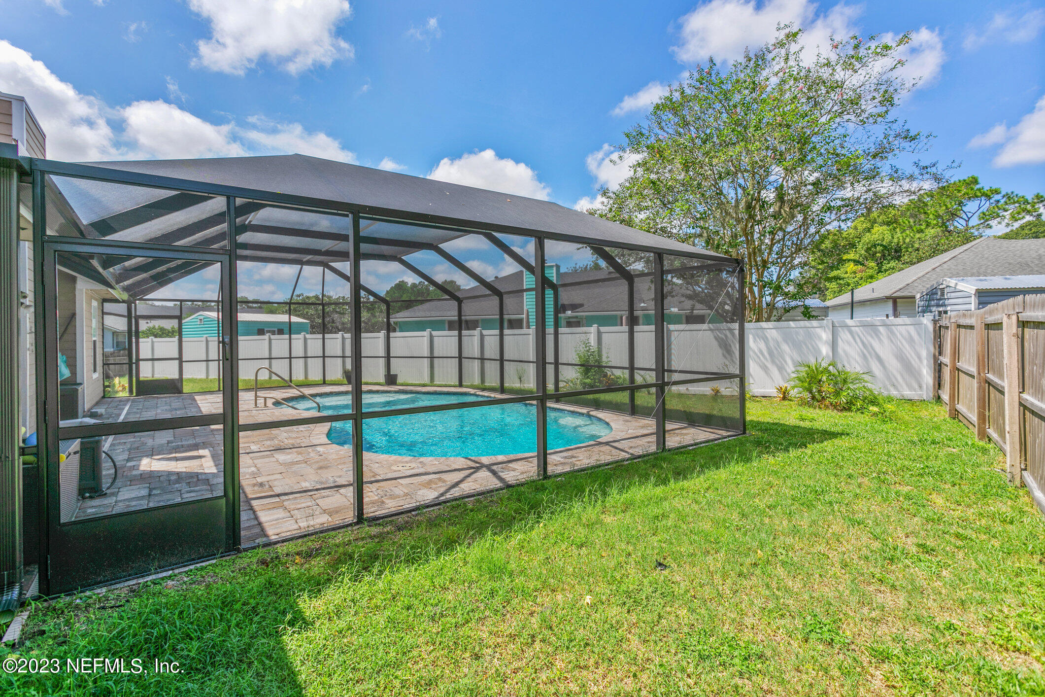 6650 Ricker Road Jacksonville, FL 32244 - Photo 36 of 41 a view of a backyard with a garden and deck