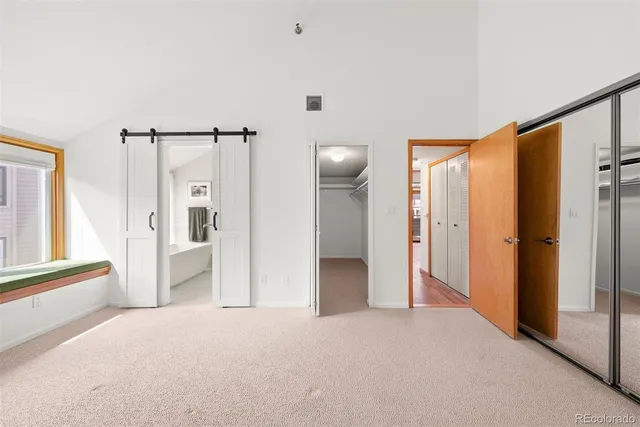 a view of a room with a tub and shower