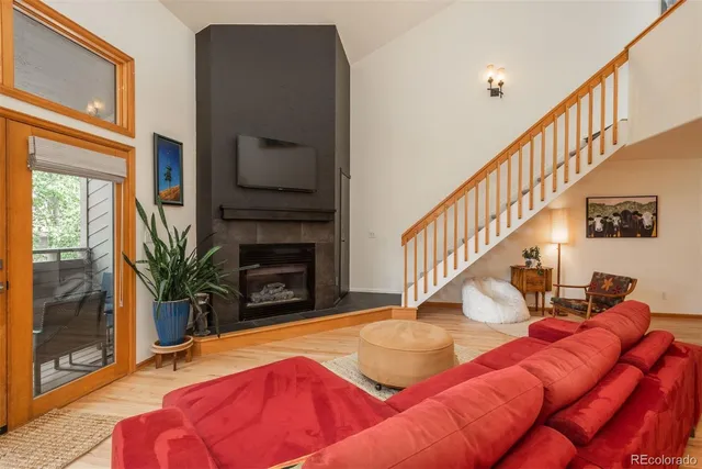 a view of entryway livingroom and hall with wooden floor