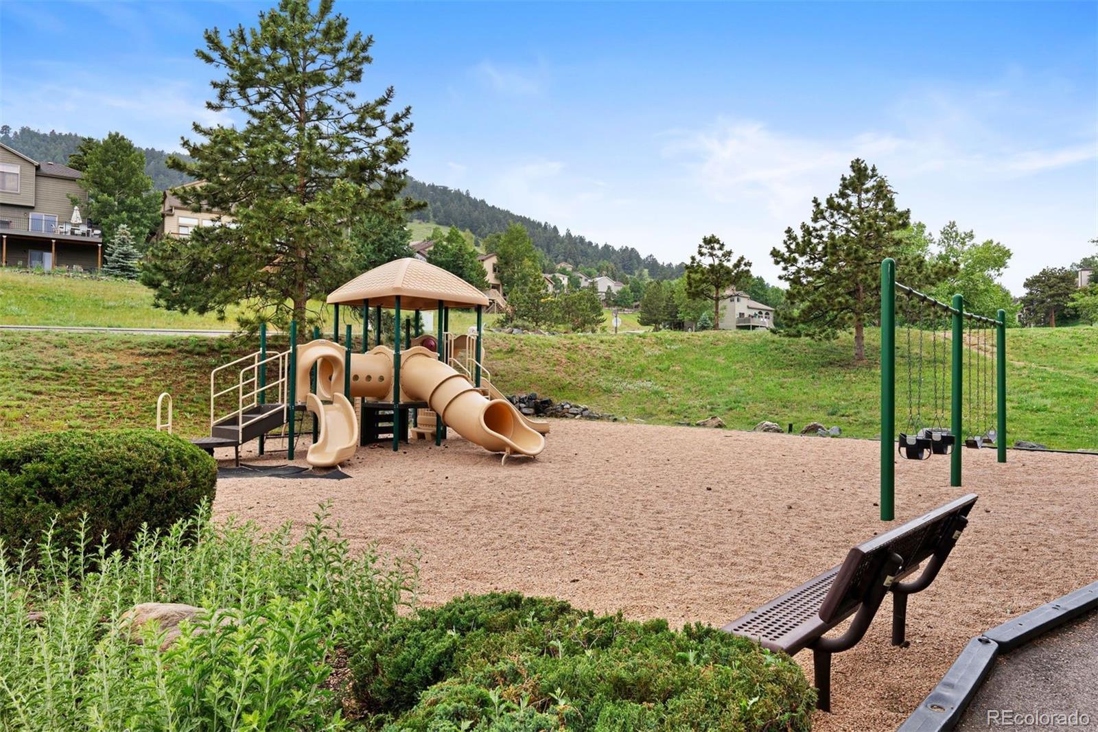 23624 Pondview Place, Unit G Golden, CO 80401 - Photo 30 of 33 a view of a patio with a table and chairs under an umbrella