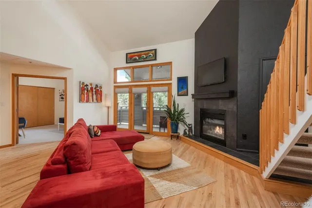 a living room with furniture fireplace and flat screen tv