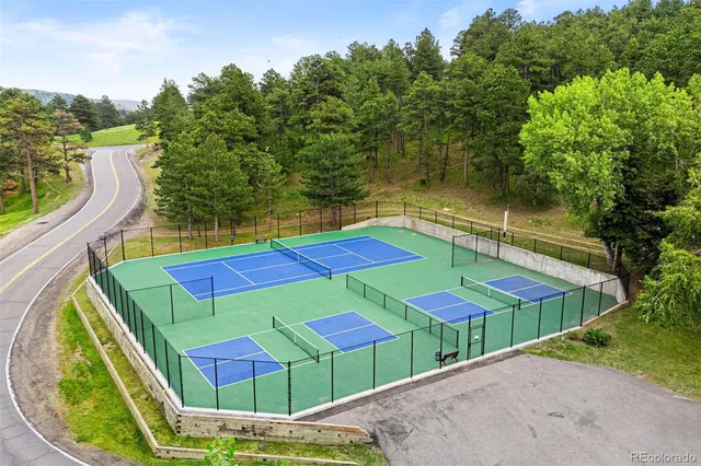 an outdoor space with pool and furniture