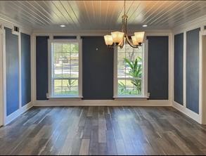 17715 Loring Lane Spring, TX 77388 - Photo 4 of 11 an empty room with wooden floor and windows