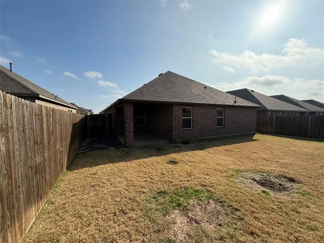 a house view with a backyard space