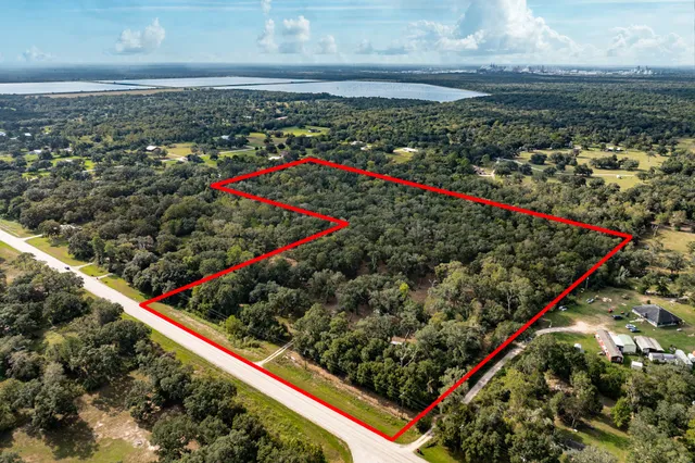 a view of a swimming pool with a yard