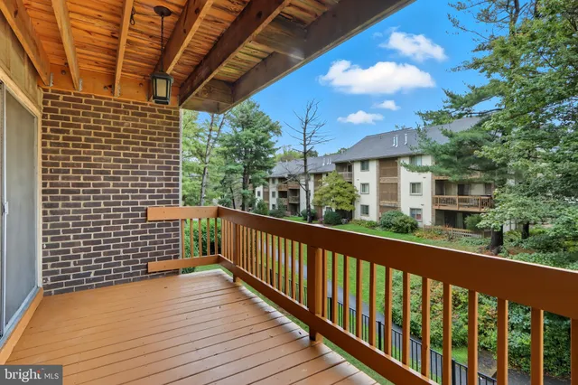 a view of balcony with wooden floor