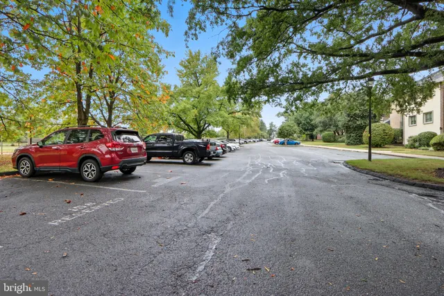 a view of a car parked on the side of a road