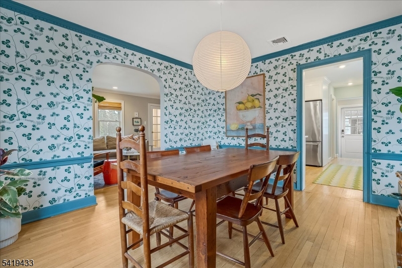 4 Rynda Road Maplewood, NJ 07040 - Photo 13 of 34 a view of a dining room with furniture and wooden floor