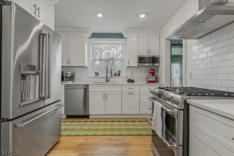4 Rynda Road Maplewood, NJ 07040 - Photo 15 of 34 a kitchen with a stove sink and refrigerator