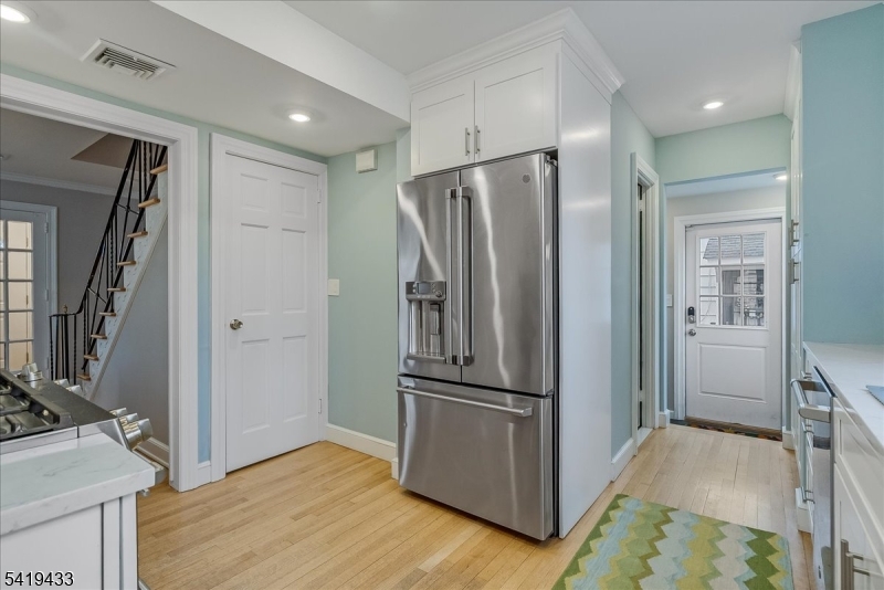4 Rynda Road Maplewood, NJ 07040 - Photo 18 of 34 a view of a refrigerator in kitchen and wooden floor