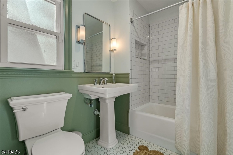 4 Rynda Road Maplewood, NJ 07040 - Photo 24 of 34 a bathroom with a sink toilet and shower