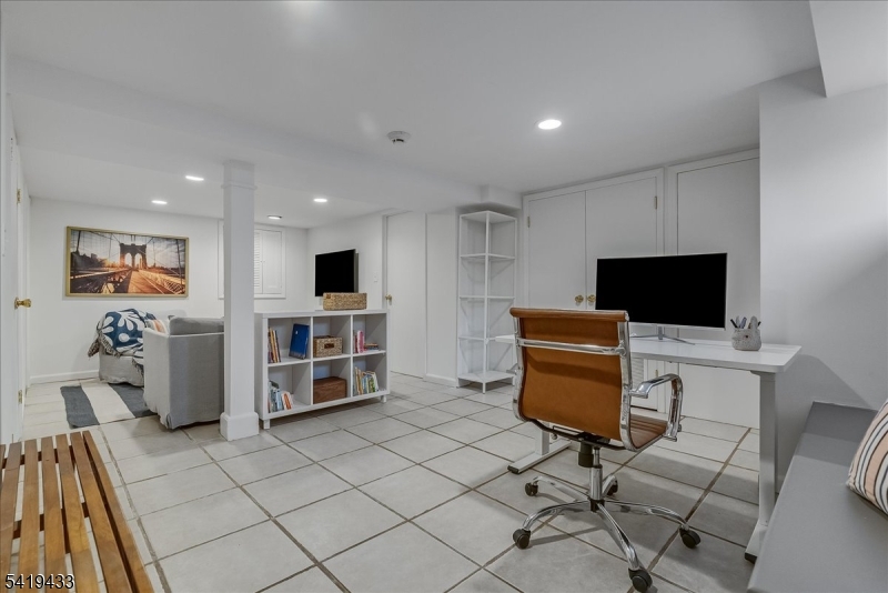 4 Rynda Road Maplewood, NJ 07040 - Photo 29 of 34 a view of a livingroom with furniture and a flat screen tv
